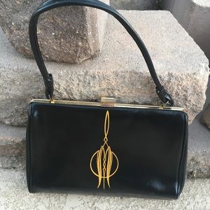 Vintage hand bag with pinstriped on both sides.